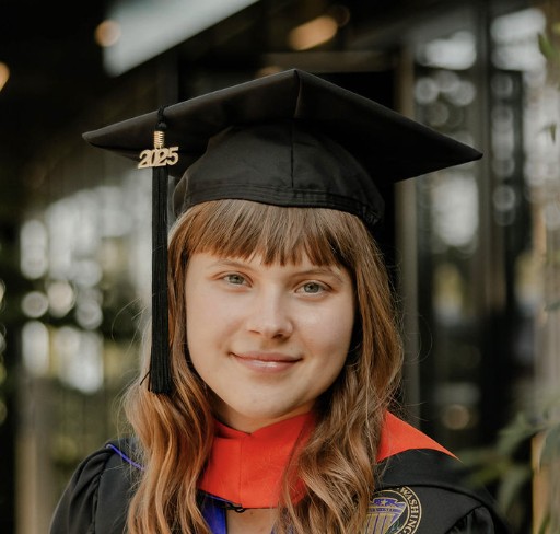 Ukrainian girl with bangs and graduation cap