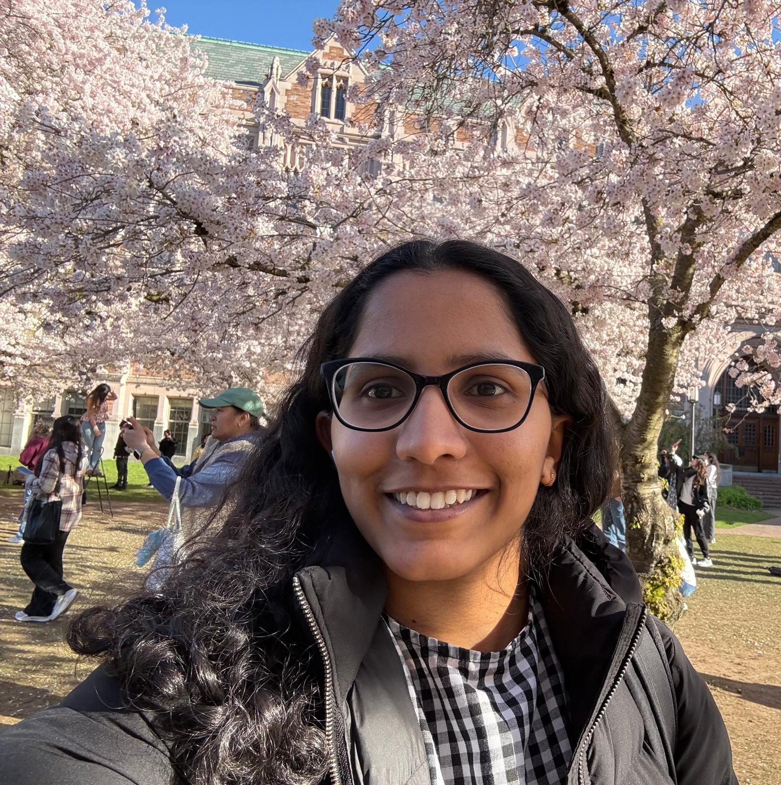 Samvedha Basireddy in a UW setting, smiling at the camera.