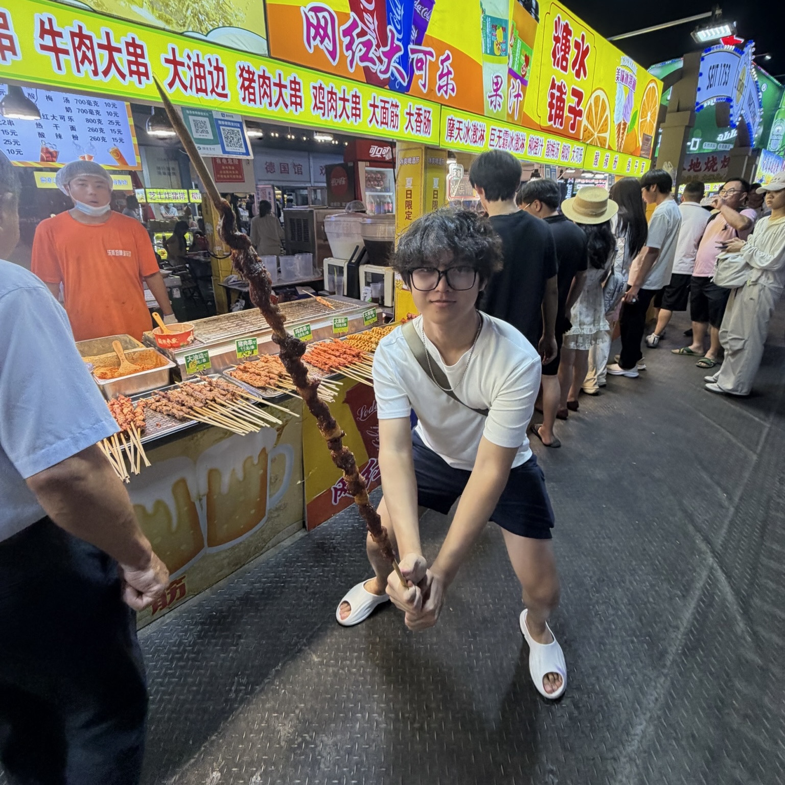 Photo taken in 0.5, Tony holding a very big piece of bbq lamb.