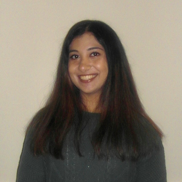photograph of girl in green sweater