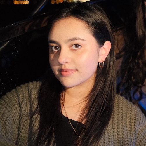 This is an image of Anum sitting on a boat.