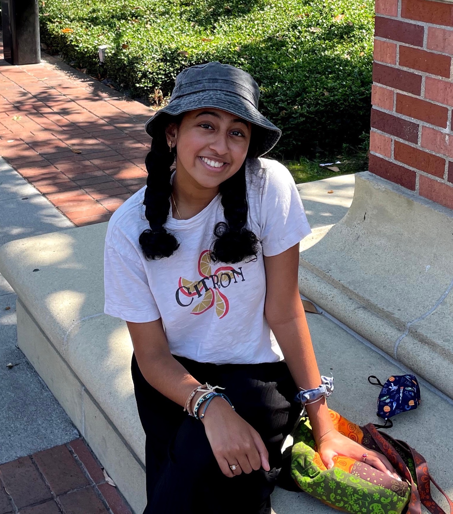 Shriya wearing a bucket hat and smiling