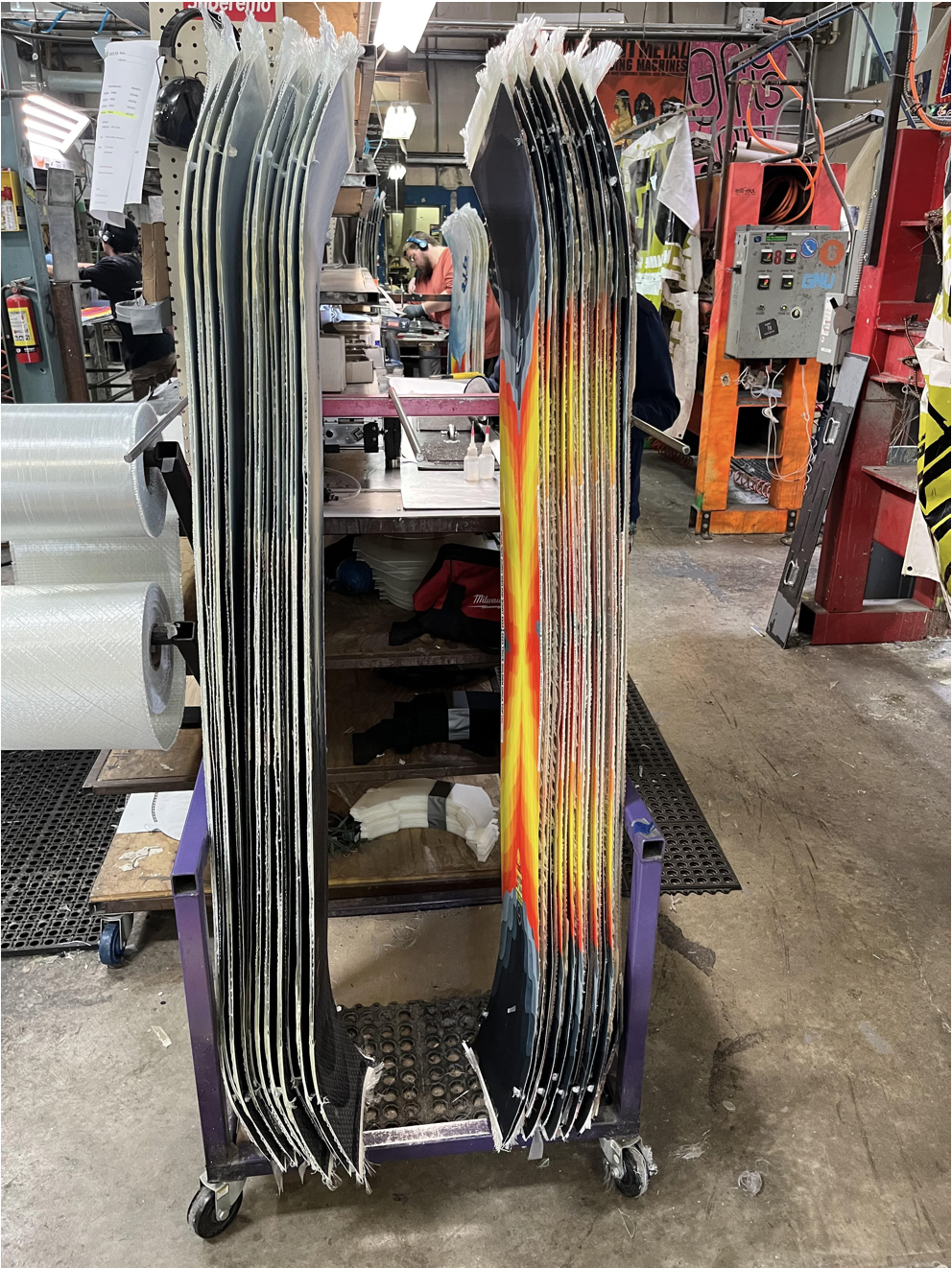 Snowboards lined up to be cut