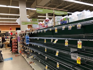 Empty bread shelves at Albertsons in Gig Harbor, WA