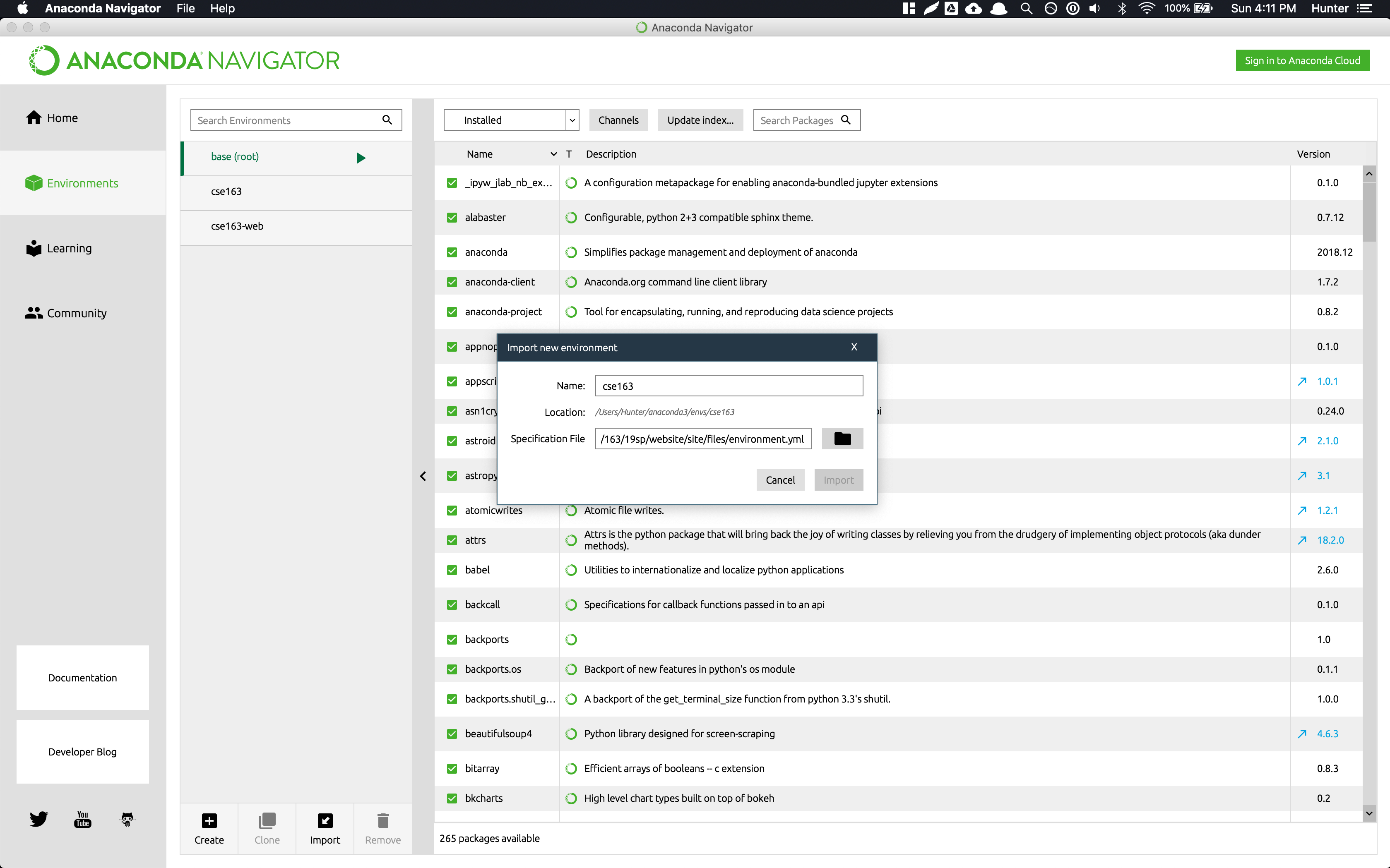 Anaconda Navigator's Environments page with the "import new environment" popup
