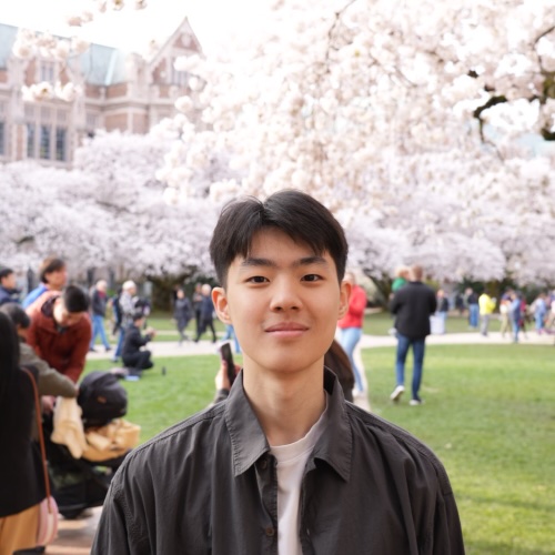 A profile picture of Jonathan Trinh surrounded by cherry blossoms.
