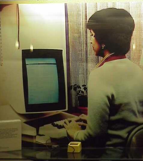 :img A picture of a woman interacting with the Xerox Alto computer, 50%