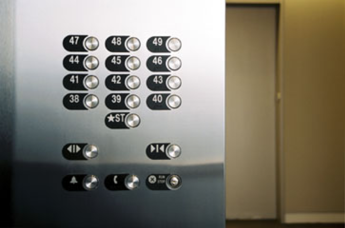 :img Picture of an elevator button panel with the labels and buttons visually associated removing ambiguity,40%