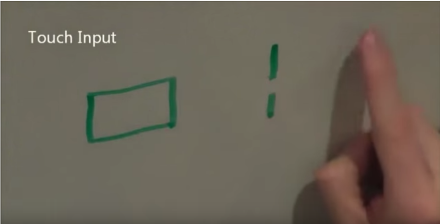 :img screen capture of the video showing both a tap target and a swipe, 100%, width