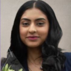 Profile photo of A brown girl in a blue dress with black hair.