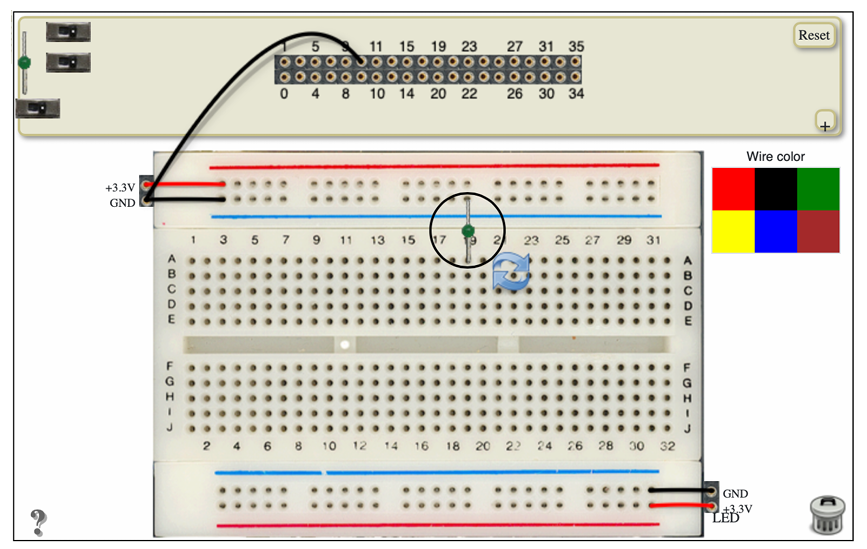 A breadboard with an LED wired to ground. The LED is circled.