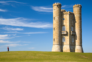 Original image of Broadway Tower, Cotswolds with a tower and a person on a field.