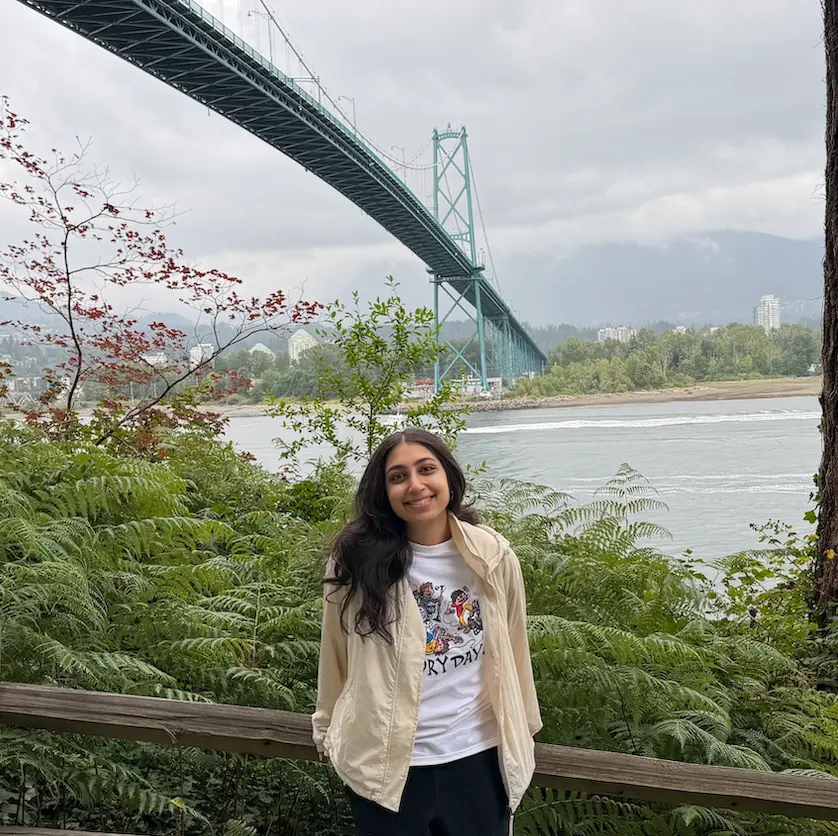 Aelysha Sharma smiling in a cafe