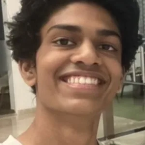 Headshot of Yojit Mandavilli, smiling at the camera.