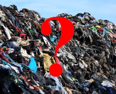 A mound of textile waste with a red question mark