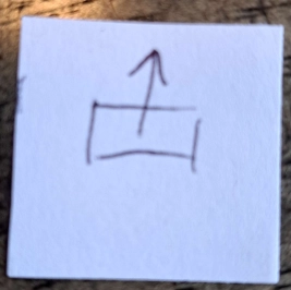 A sketch of a rectangle with an arrow pointing up out of it.