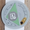 A paper prototype watch face showing the a phone contact with a solid triangle behind it.