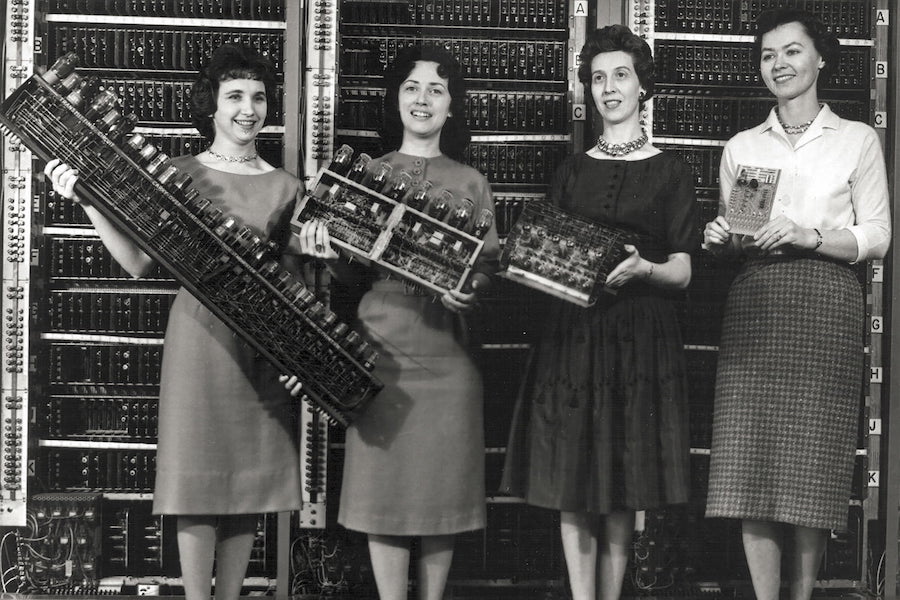 Patsy Simmers, holding ENIAC board; Gail Taylor, holding EDVAC board; Milly Beck, holding ORDVAC board; and Norma Stec, holding BRLESC-I board. Source: U.S. Army/ARL Technical Library Archives