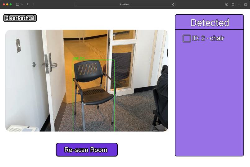 Website with a white background. In the top left there is a grey and white ClearPath.ai logo and below it there is an image of a black chair blocking an open door. The chair is surrounded by a neon green box with the text chair ID:2. Below this image is a purple button with the text Re-scan Room. To the right is a purple box with the title Detected with the text chair in the checklist.