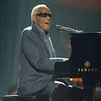 Head shot of ray Charles in front of a microphone
