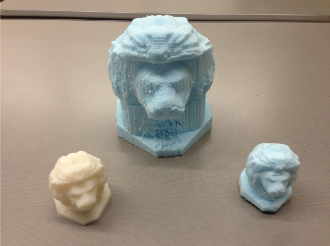 :img three 3D printed lion heads two are subtractive printing one is additive, 80%, width