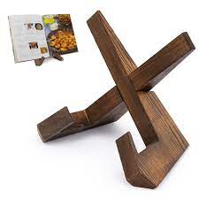 :img Two arms that cross in such a way that they create a space to hold a cookbook up and open on the counter, 50%, width